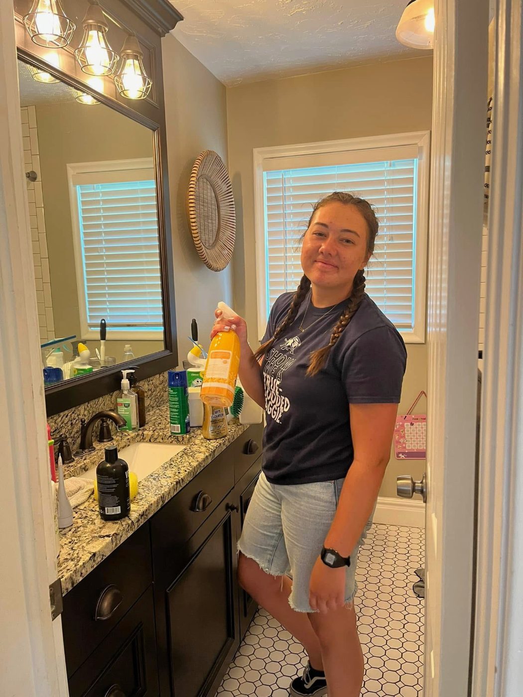 Cleaning a bathroom with our handmade non-toxic cleaner