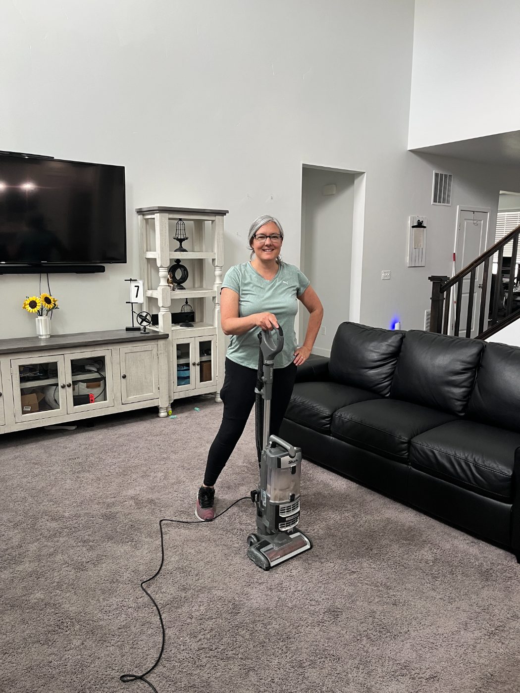 Kat cleaning a client's living room in Utah